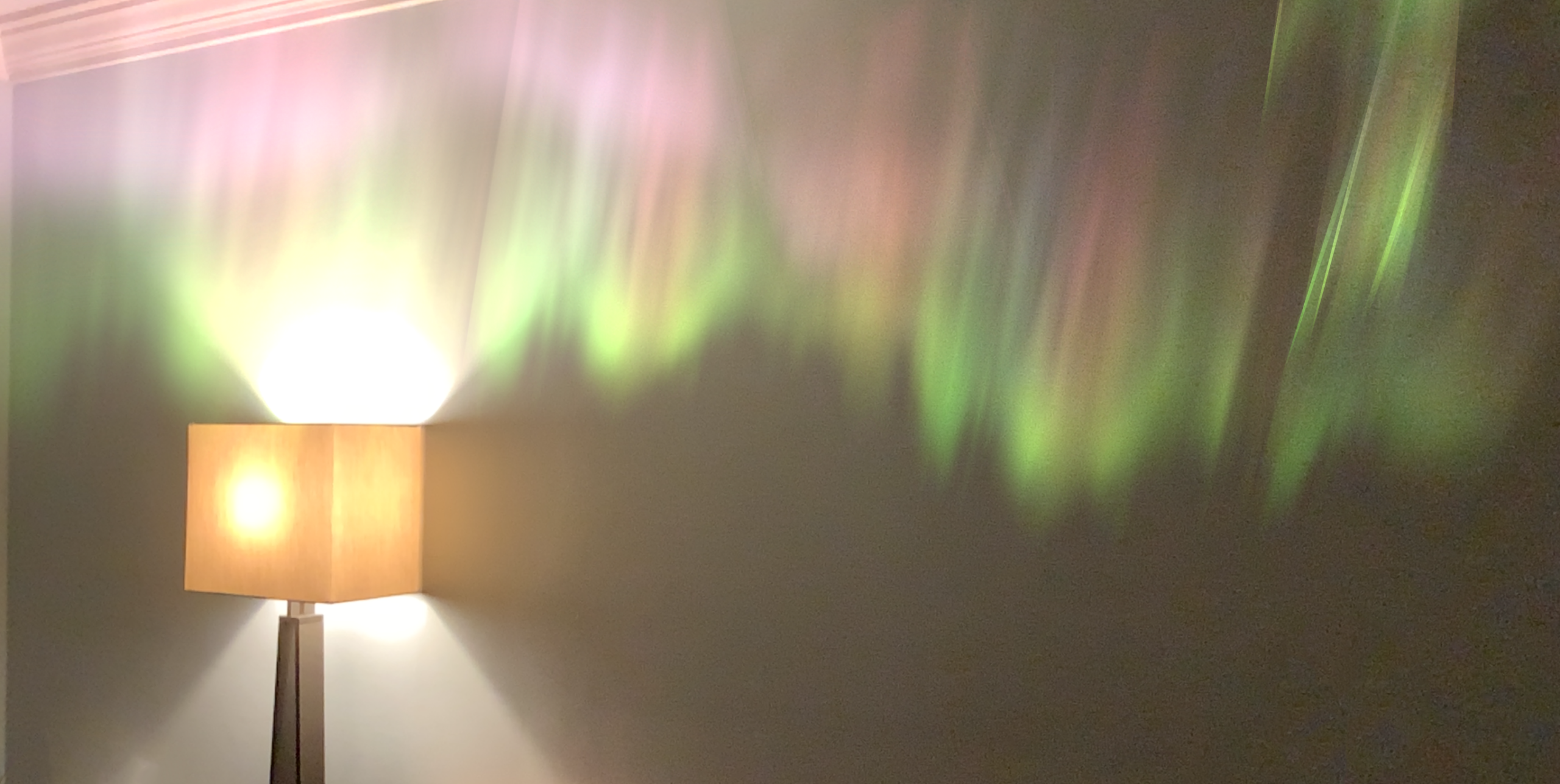 An augmented reality Aurora Borealis emerges from a lamp
